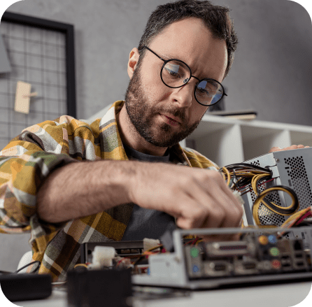 man repairing a technologial device