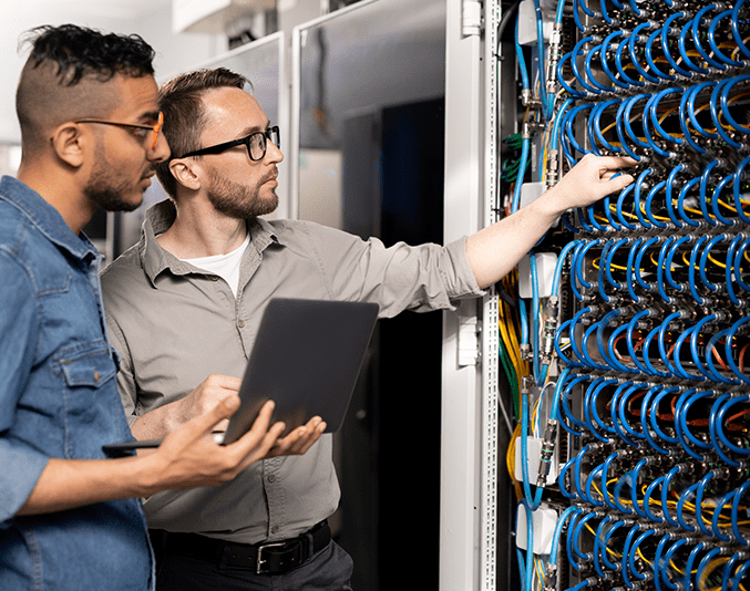 two men looking at a server